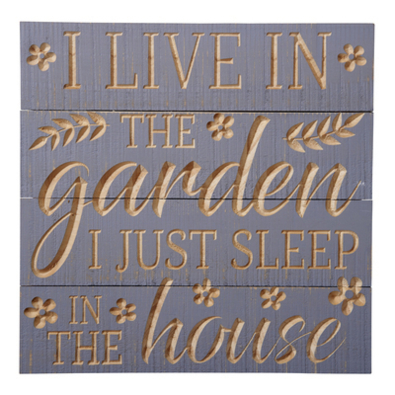 I live in the Garden I just sleep in the House. Wooden sign by Transomnia with a carved slatted design. Perfect for someone who loves gardening. Would make a lovely gift. 